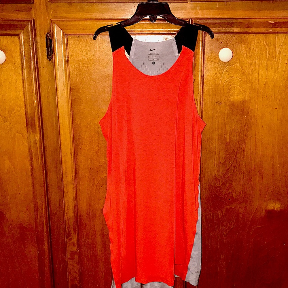 Nike tank beautiful red/orange color sz small. Can tie a knot at the bottom side
